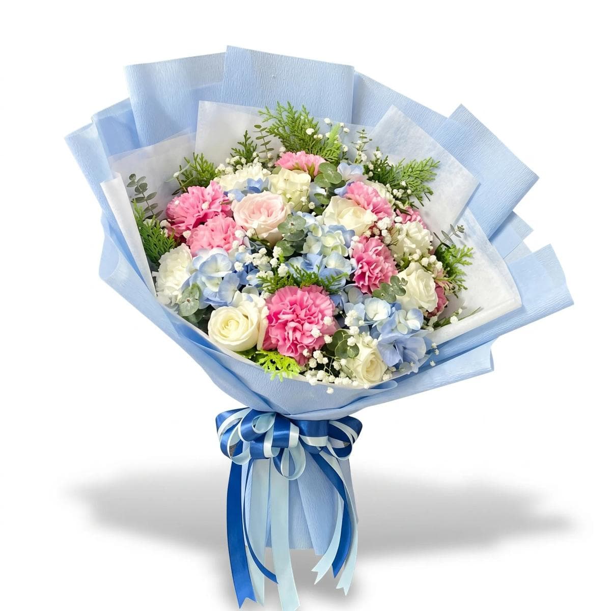 A soft mixed bouquet in white and pastel tones — thoughtfully arranged with seasonal blooms and light greenery for a clean, elegant look. Flower types may vary based on daily availability, while the overall style and color palette stay the same.